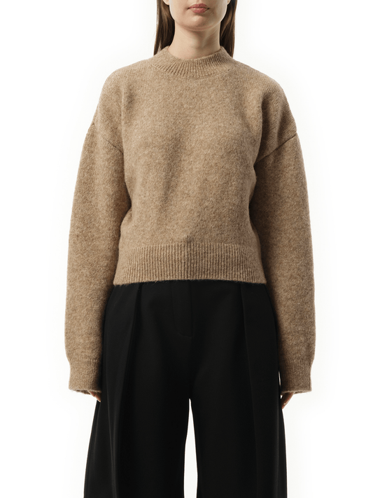 Image of a model wearing Outerwear. Productname: JACQUEMUS La Maille Jacquemus in BEIGE colour by brand - JACQUEMUS