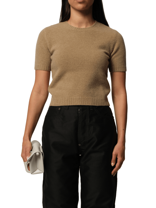 Image of a model wearing Outerwear. Productname: MAISON MARGIELA Lambswool Short Sleeve Sweater in Beige colour by brand - MAISON MARGIELA