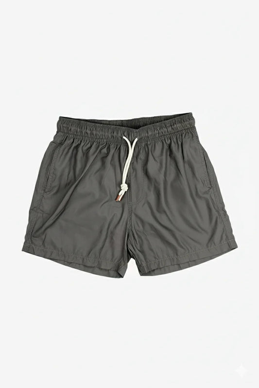 Image of a model wearing Shorts. Product name - Eufemia Olive Swim Shorts in Olive colour by brand - Anthony Squires