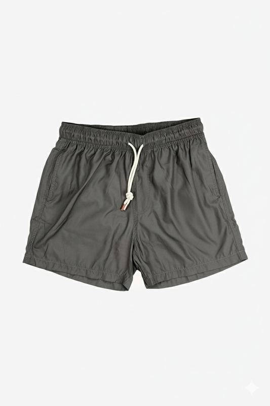 Image of a model wearing Shorts. Product name - Eufemia Olive Swim Shorts in Olive colour by brand - Anthony Squires
