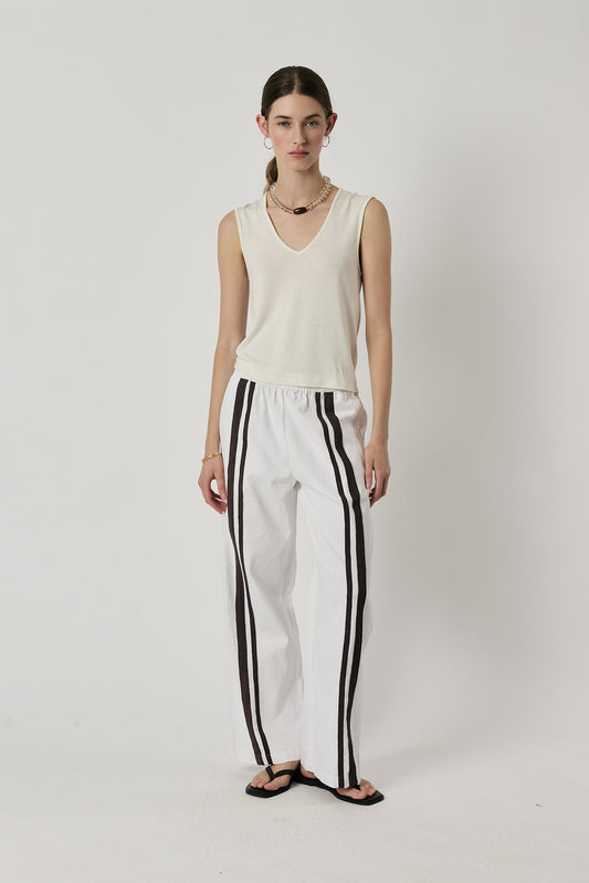 Image of a model wearing Pants. Product name - Giliann Adela Pant White in White colour by brand - Giliann
