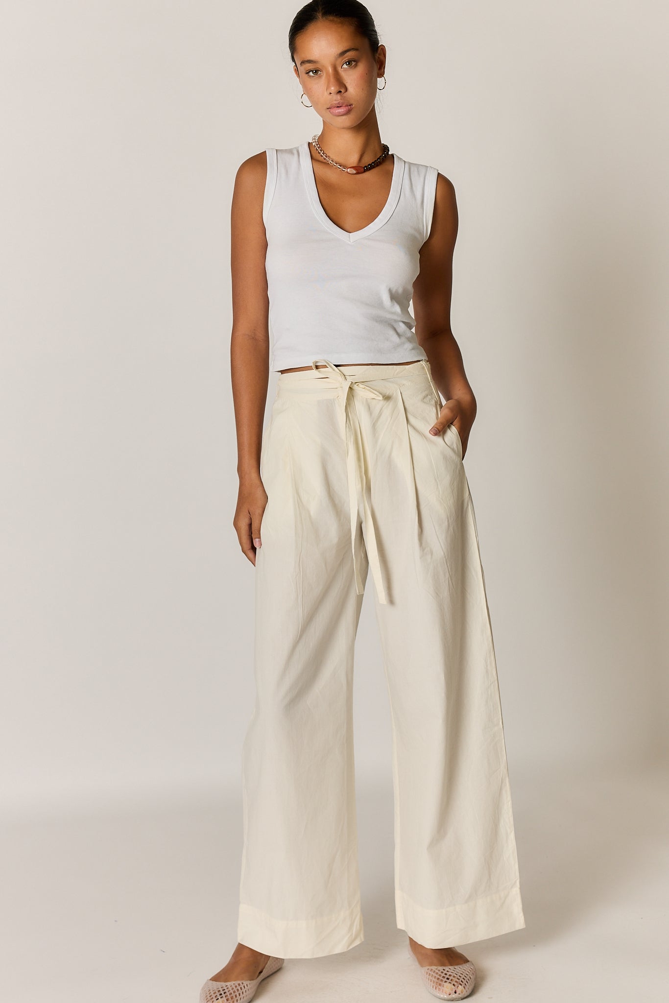 Image of a model wearing Pants. Product name - Giliann Floyd Tie Pant Coconut in Coconut colour by brand - Giliann