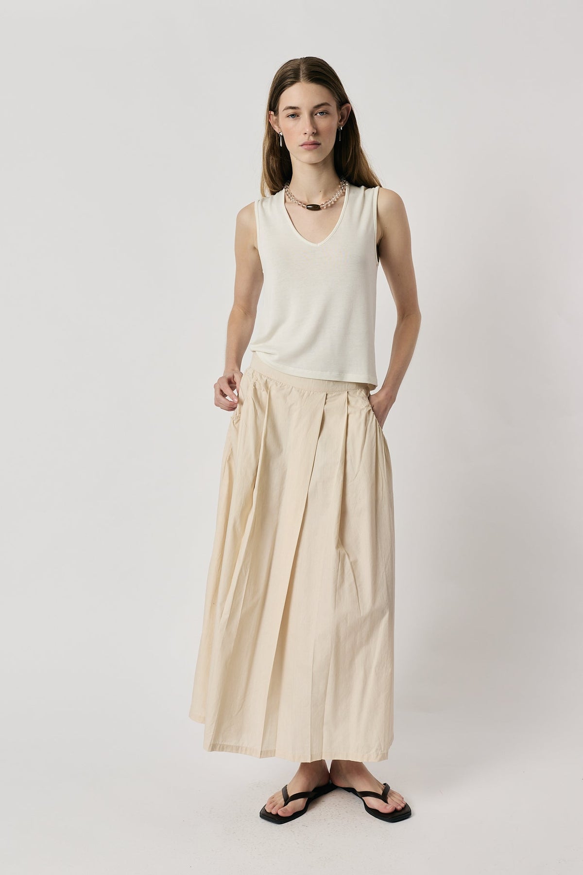 Image of a model wearing Skirts. Product name - Giliann Ines Skirt Cream in Cream colour by brand - Giliann