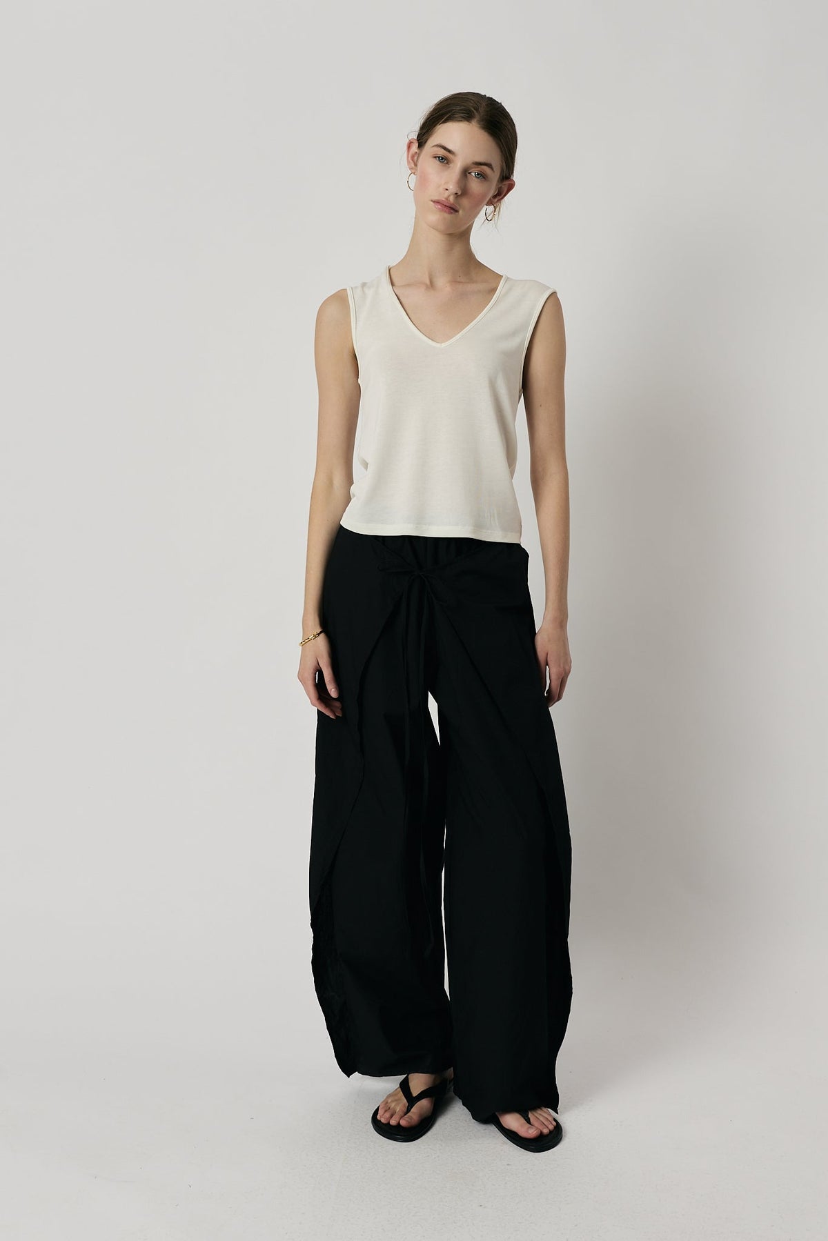 Image of a model wearing Pants. Product name - Giliann Luna Pant Black in Black colour by brand - Giliann