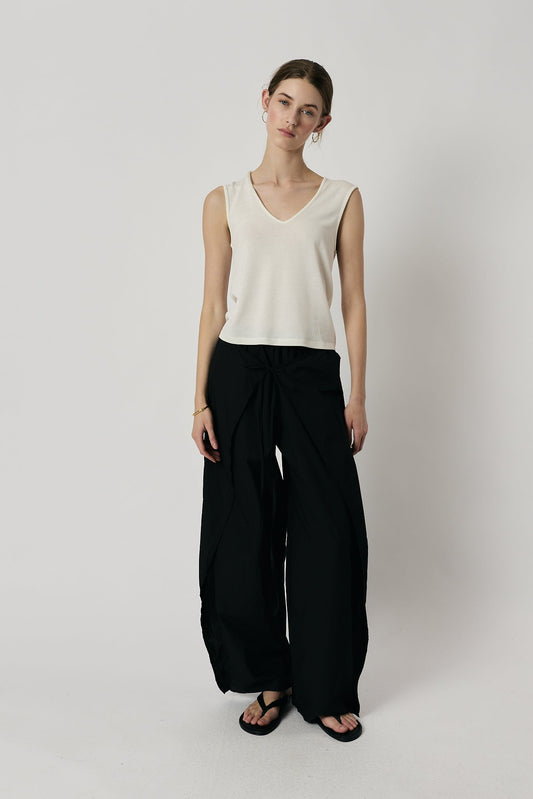 Image of a model wearing Pants. Product name - Giliann Luna Pant Black in Black colour by brand - Giliann