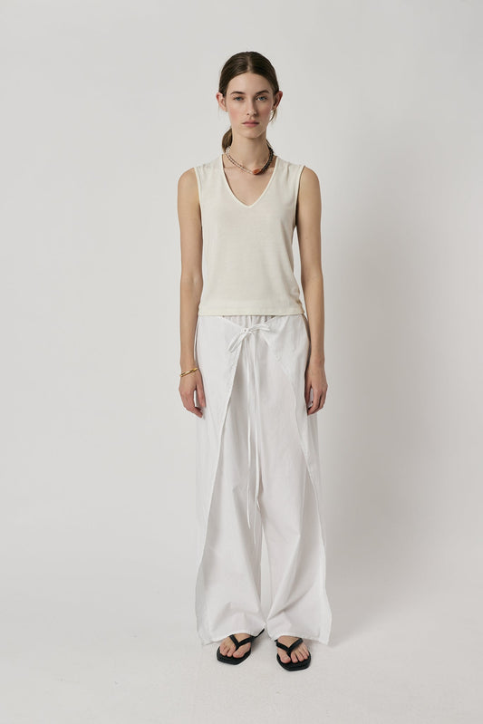 Image of a model wearing Pants. Product name - Giliann Luna Pant White in White colour by brand - Giliann