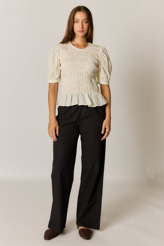 Image of a model wearing Tops. Product name - Giliann Pyke Shirred Top Coconut in Red colour by brand - Giliann
