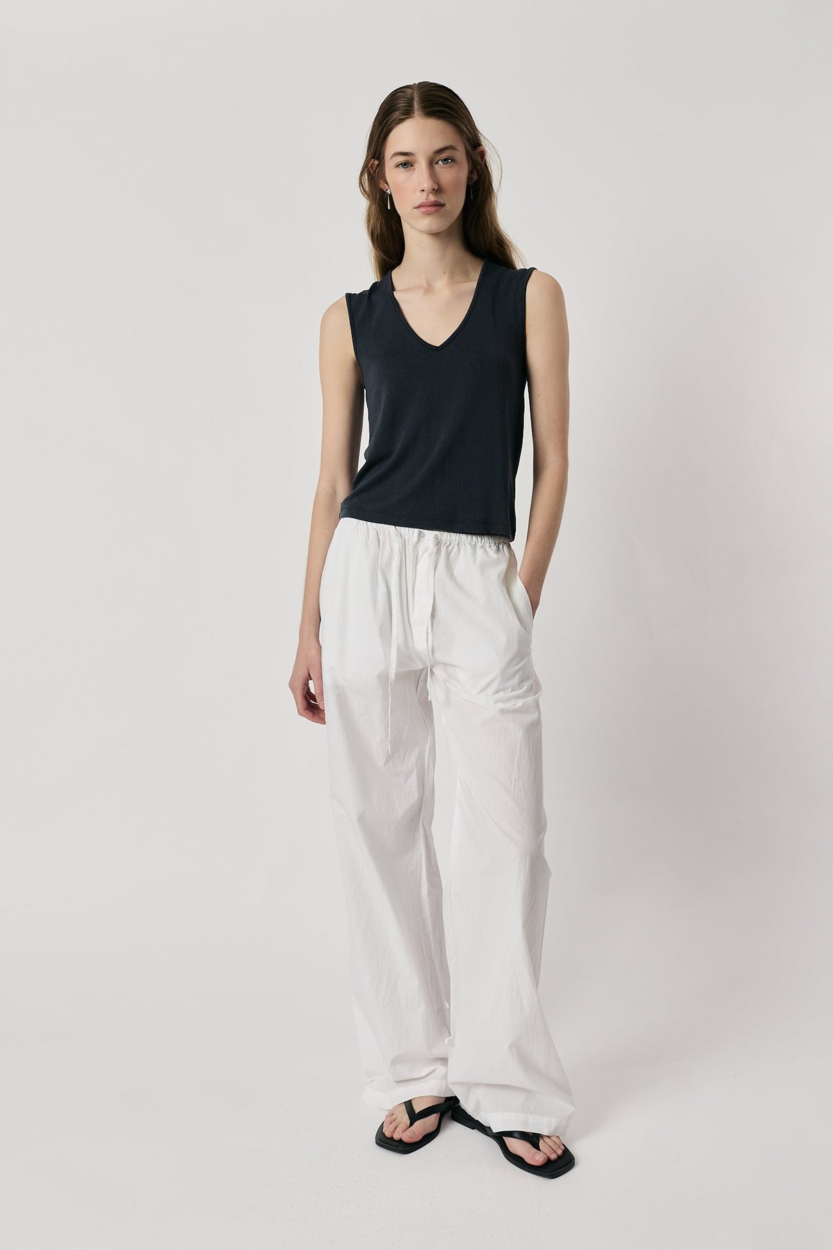 Image of a model wearing Pants. Product name - Giliann Romy Pant White in White colour by brand - Giliann
