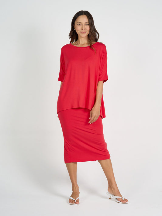 Image of a model wearing Tops. Product name - Gina Oversized Slouch Bamboo T-Shirt Lipstick in Lipstick colour by brand - Lou Lou