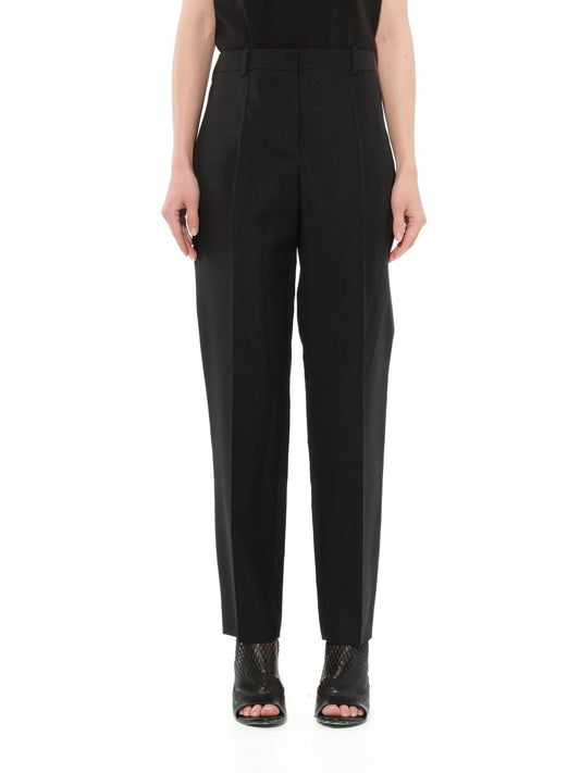 Image of a model wearing Pants. Productname: GIVENCHY Pants Black in BLACK colour by brand - GIVENCHY