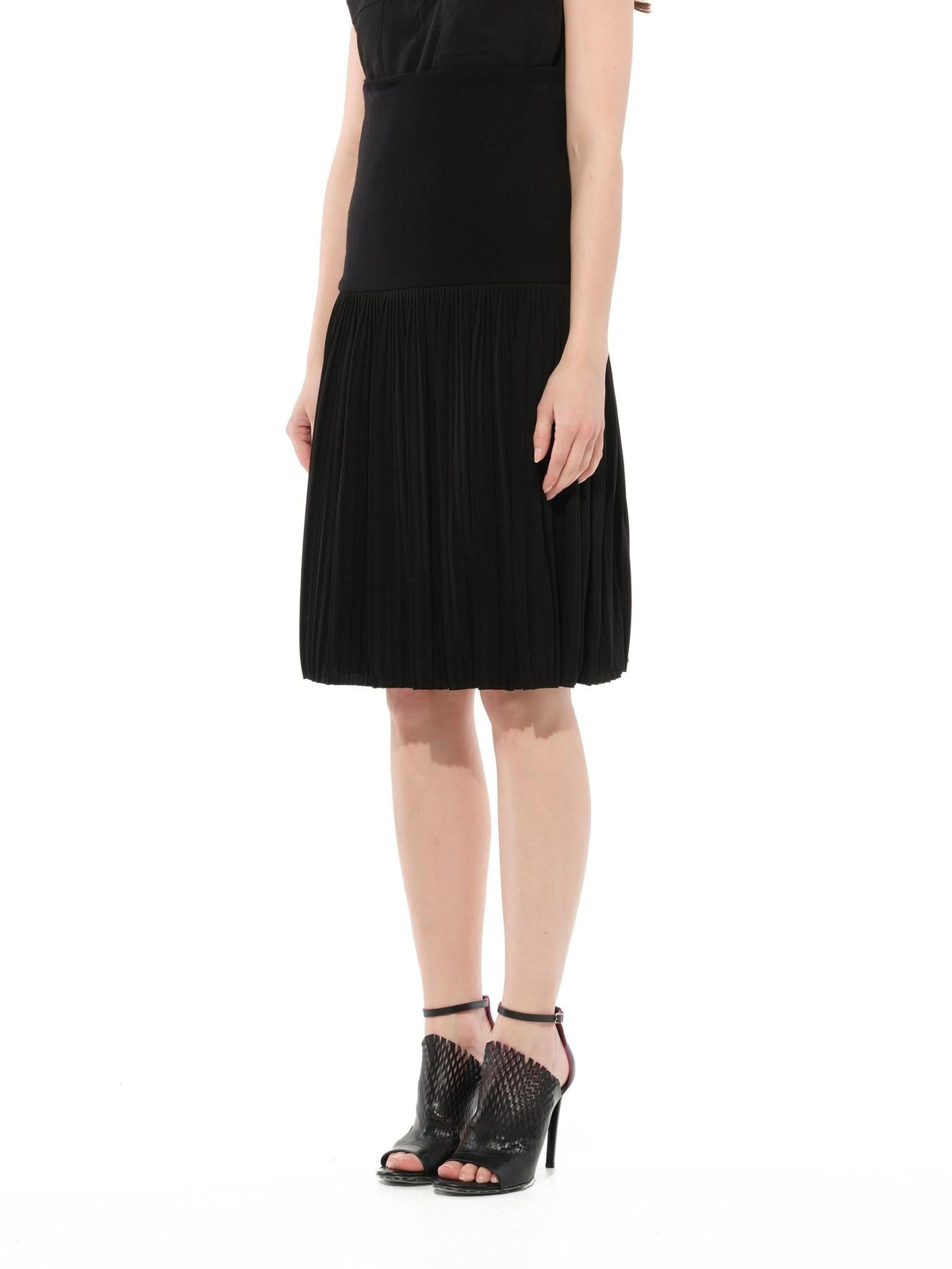 Image of a model wearing Skirts. Product name - Short Skirt in Black colour by brand - GIVENCHY