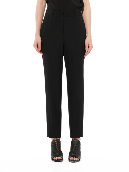Image of a model wearing Pants. Productname: GIVENCHY Trousers in BLACK colour by brand - GIVENCHY
