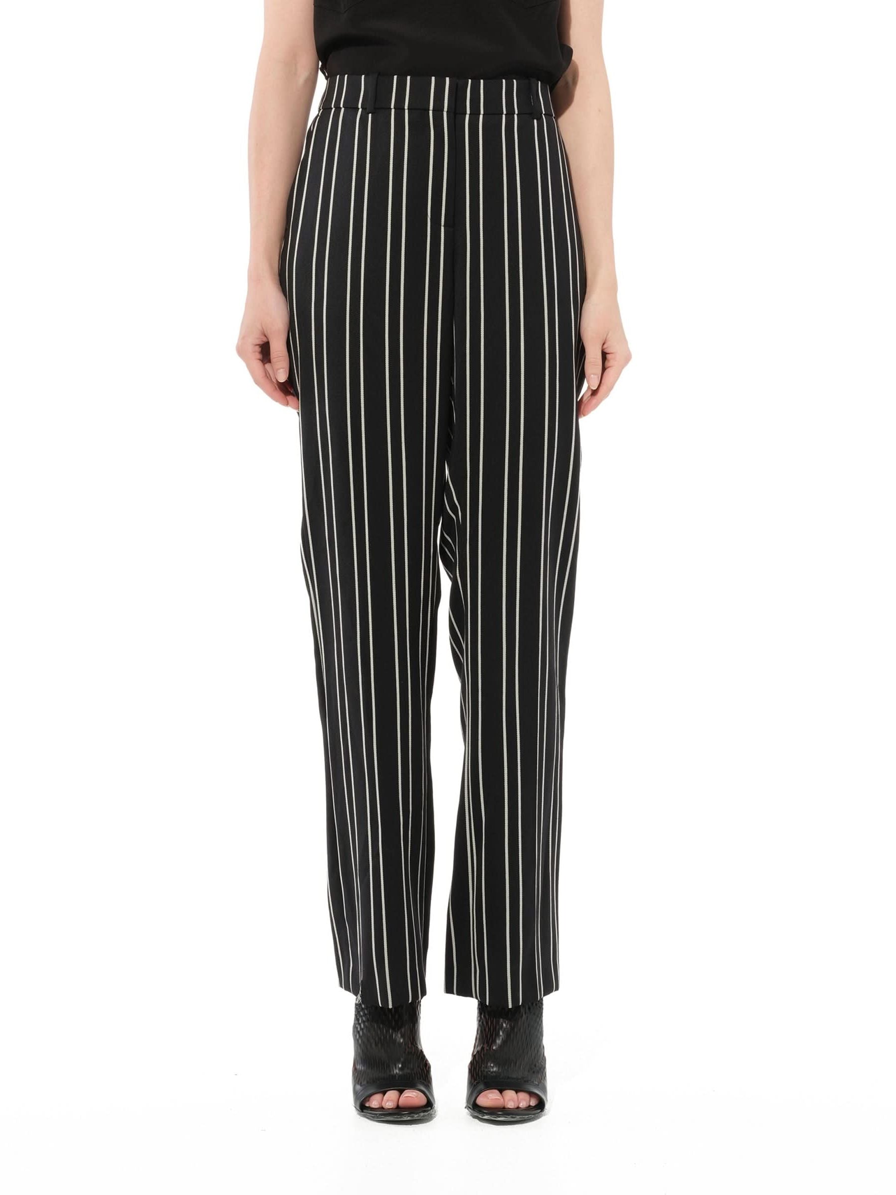 Image of a model wearing Pants. Product name - Trousers in Black colour by brand - GIVENCHY