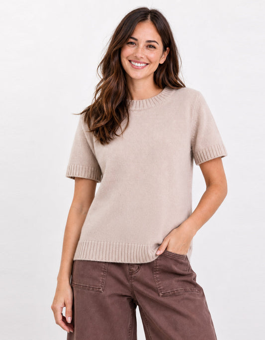 Image of a model wearing Outerwear. Product name - Goddess Wool Cashmere Knit Tee Oat in Oat colour by brand - Stories Be Told
