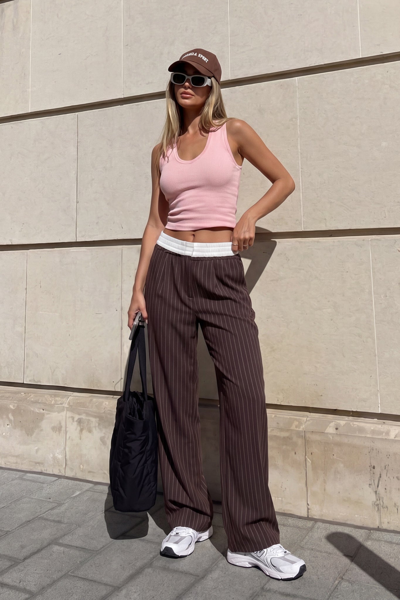 Image of a model wearing Pants. Product name - Kya Brown Stripe Pants in Brown colour by brand - HEYCHIC