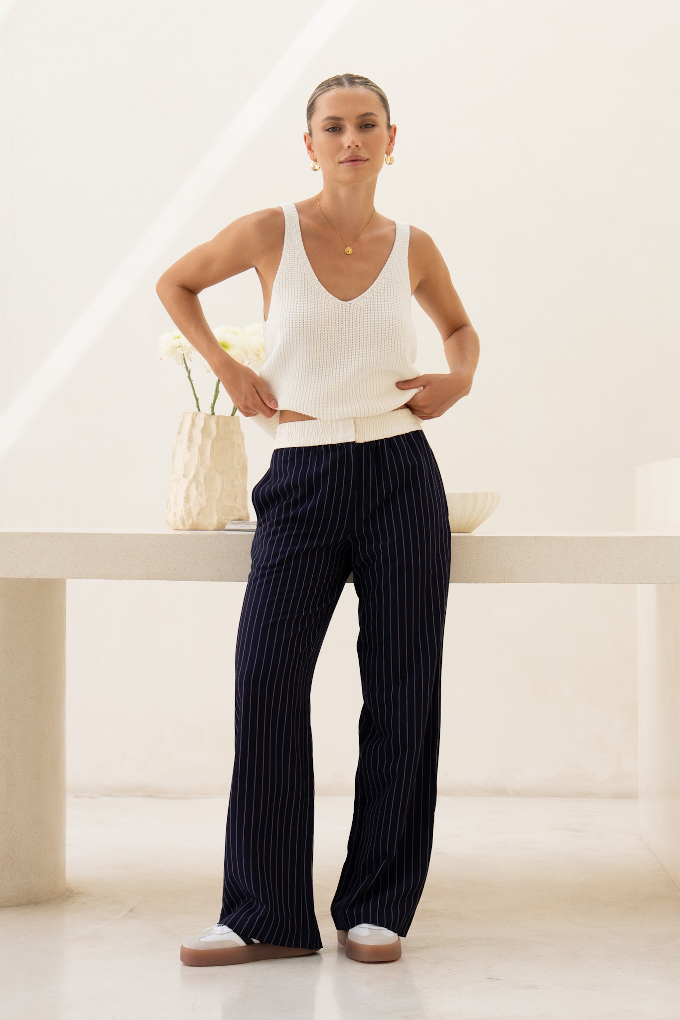 Image of a model wearing Pants. Product name - Kya Navy Stripe Pants in Navy colour by brand - HEYCHIC