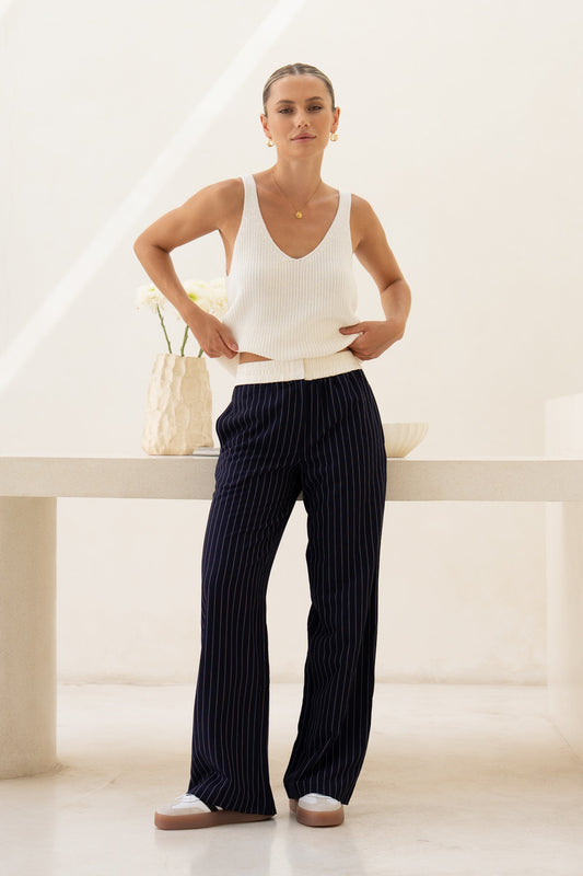Image of a model wearing Pants. Product name - Kya Navy Stripe Pants in Navy colour by brand - HEYCHIC