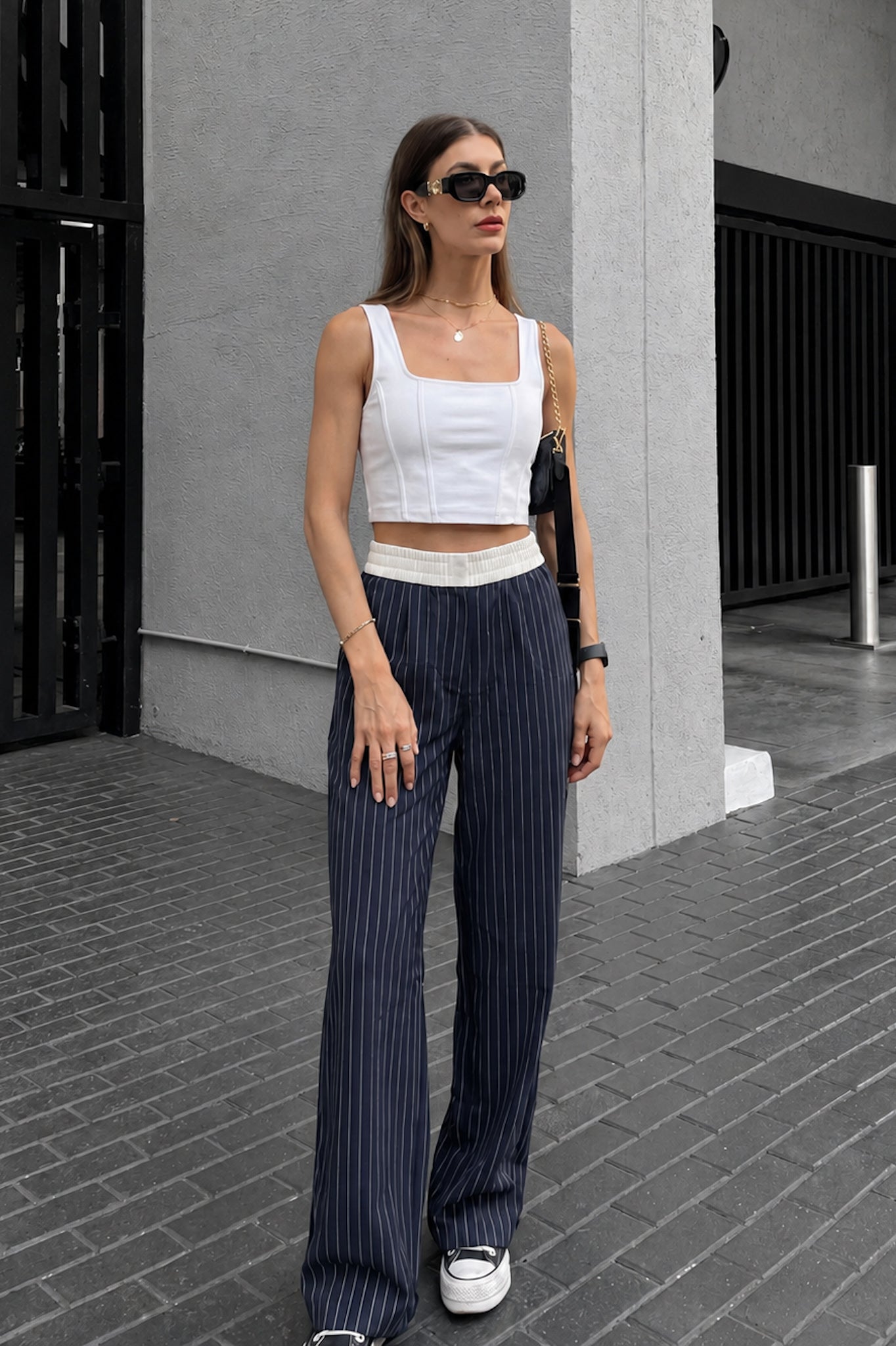 Image of a model wearing Pants. Product name - Kya Navy Stripe Pants in Navy colour by brand - HEYCHIC
