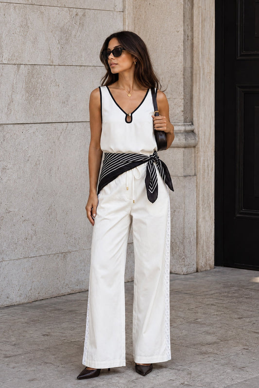 Image of a model wearing Pants. Product name - Jia Cream Lace Detail Pants in Cream colour by brand - HEYCHIC