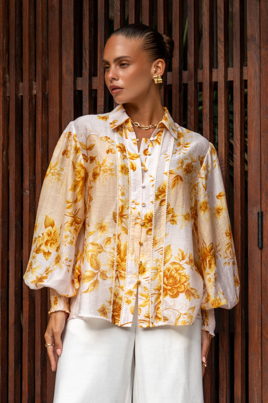 Image of a model wearing Tops. Product name - Fiorella Yellow Floral Balloon Sleeve Blouse in Floral colour by brand - Heychic