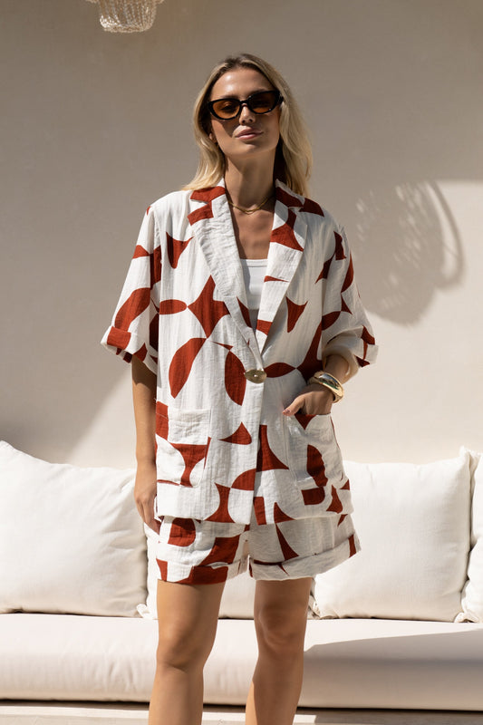 Image of a model wearing Tops. Productname: HEYCHIC Suki Brown Geo Notch Collar Shirt in Brown colour by brand - HEYCHIC