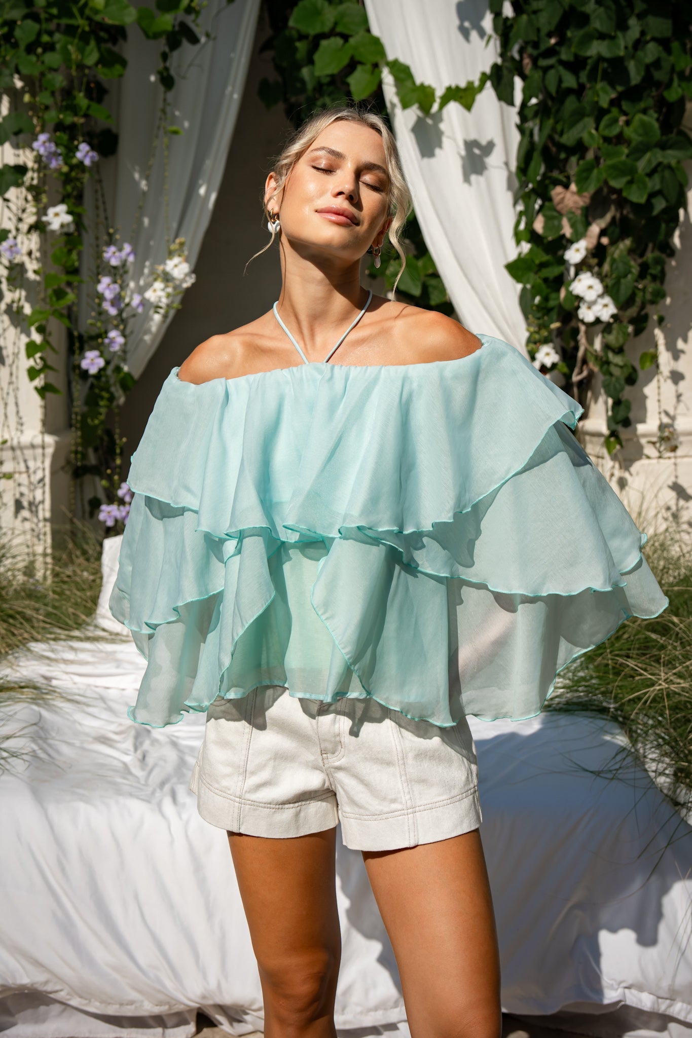Image of a model wearing Tops. Product name - Vivie Green Layer Top in Green colour by brand - HEYCHIC