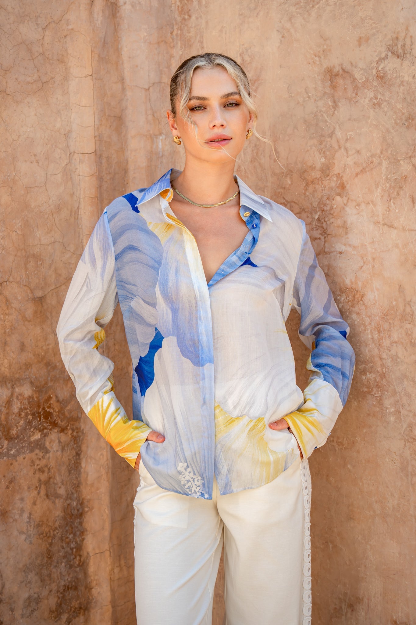 Image of a model wearing Tops. Product name - Hibiscus Blue Floral Shirt in Blue colour by brand - HEYCHIC