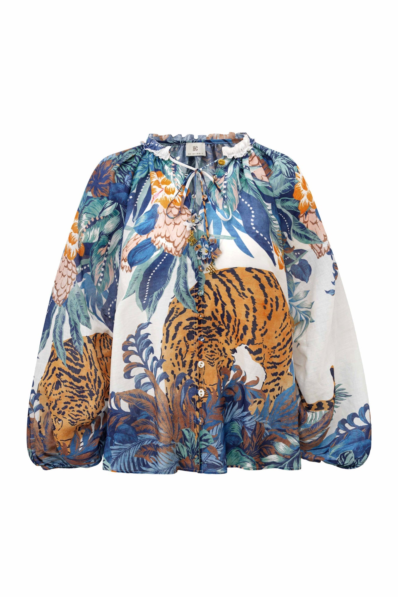 Image of a model wearing Tops. Product name - Wild Blue Tropical Blouse in Blue colour by brand - HEYCHIC