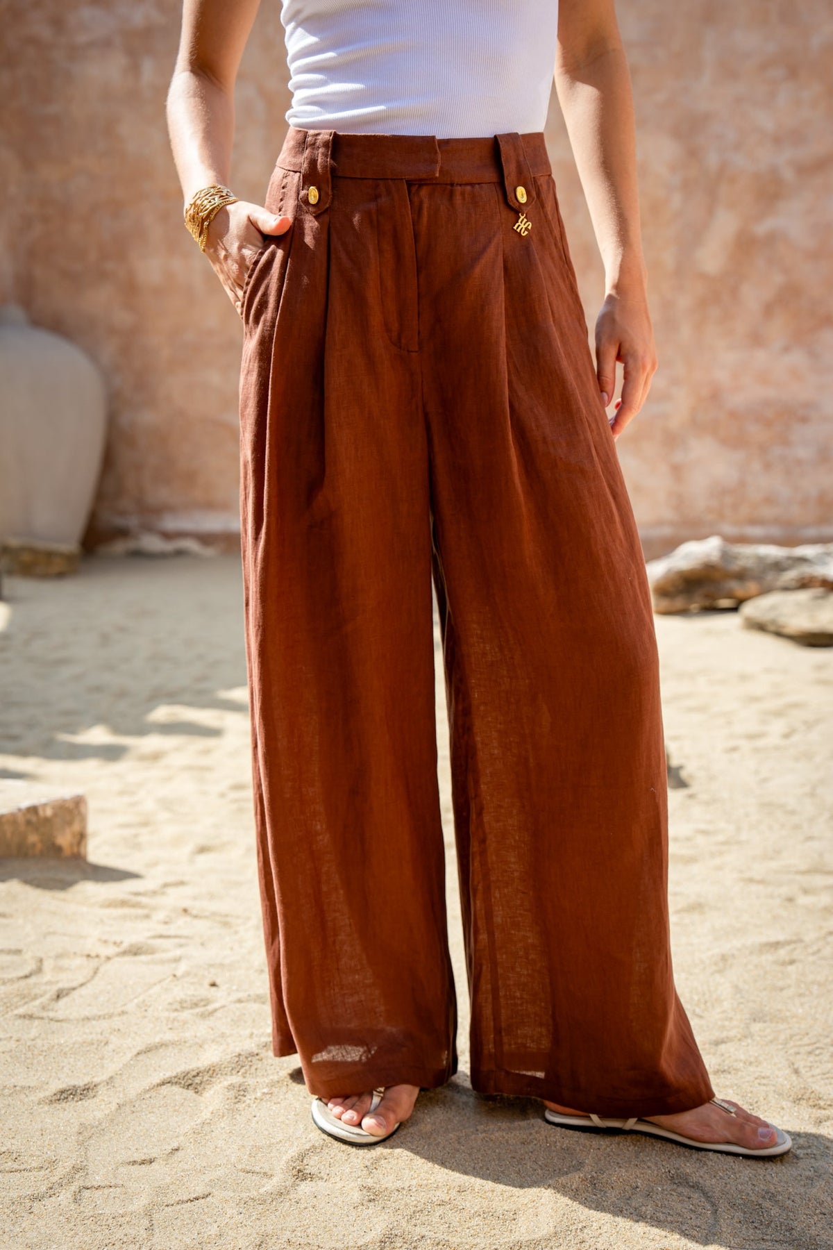 Image of a model wearing Pants. Product name - Cael Brown Linen Pants in Brown colour by brand - HEYCHIC