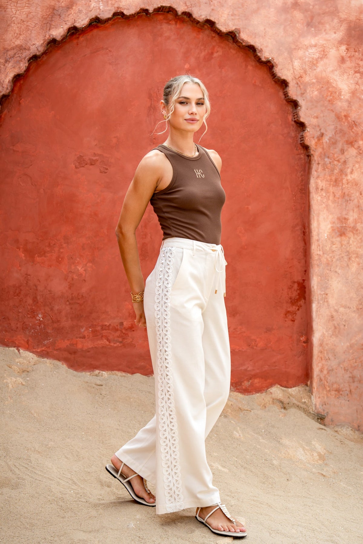 Image of a model wearing Pants. Product name - Jia Cream Lace Detail Pants in Cream colour by brand - HEYCHIC