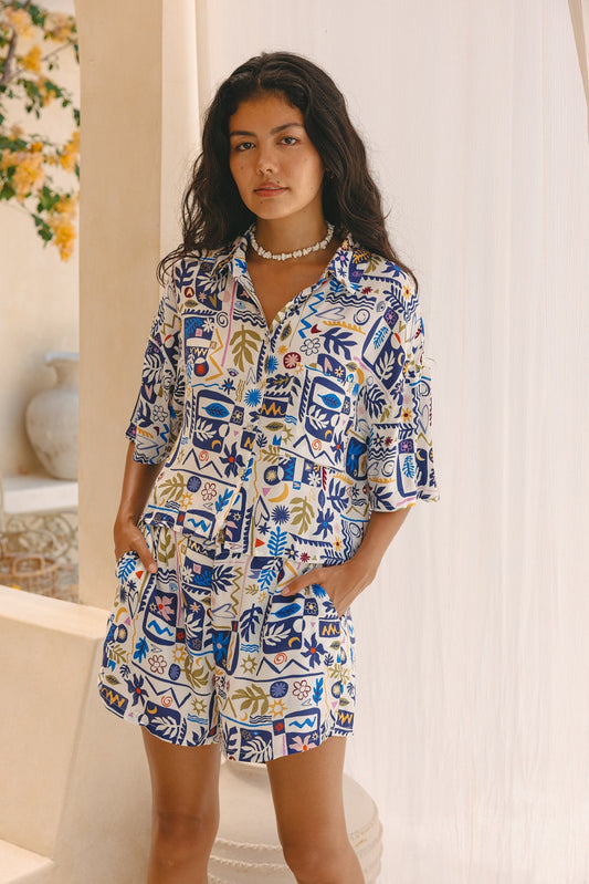 Image of a model wearing Pants. Productname: HEYCHIC Zephyra Abstract Print High-Waisted Shorts in Blue colour by brand - HEYCHIC