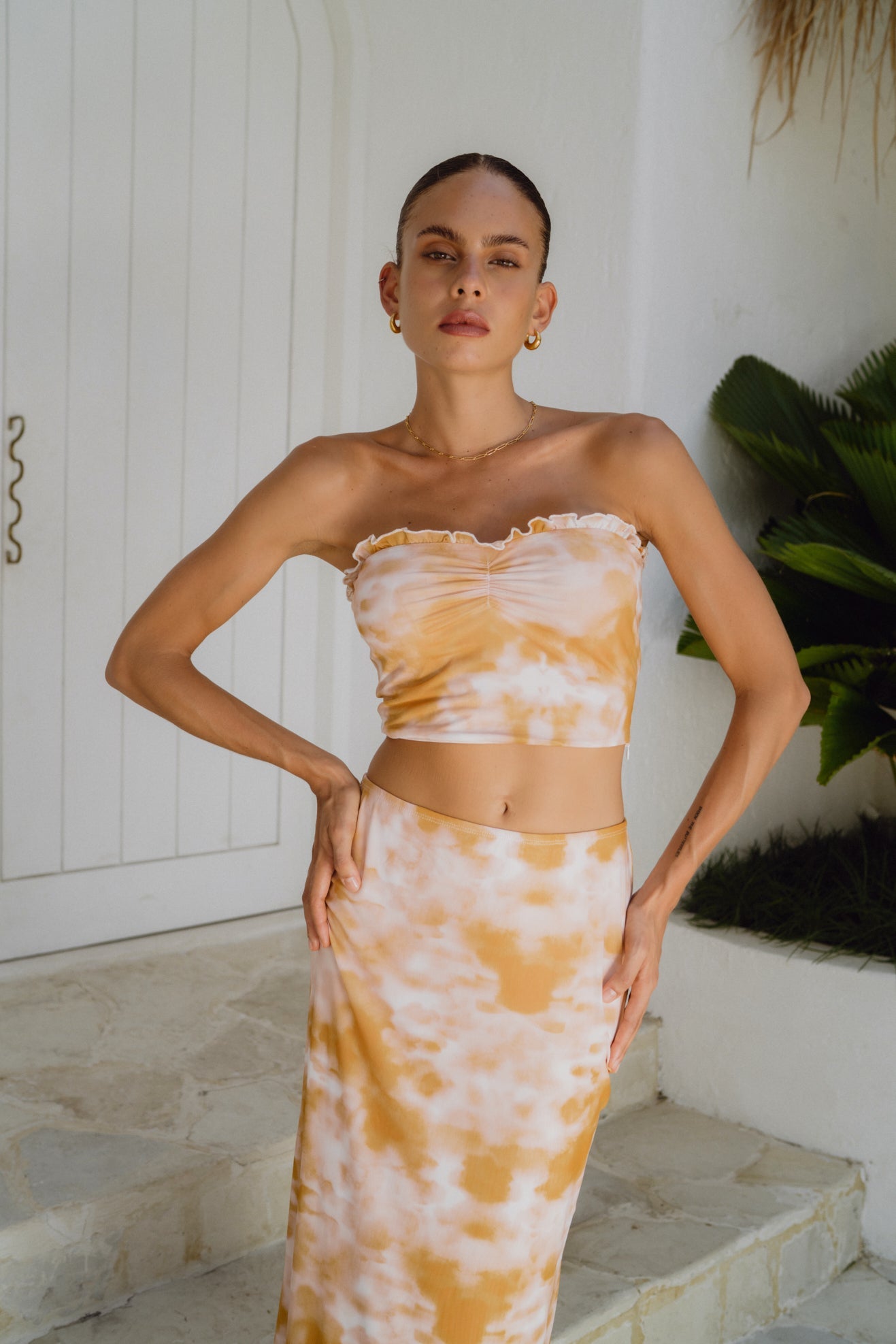Image of a model wearing Tops. Productname: Heychic Isabela Yellow Tie Dye Mesh Tube Top in Yellow colour by brand - Heychic