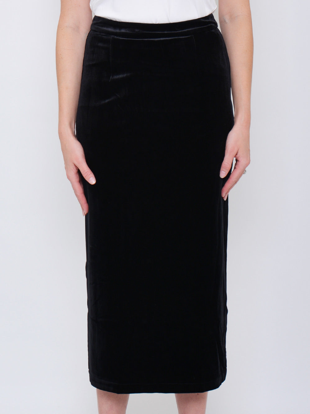 Image of a model wearing Skirts. Product name - YELTUOR X HANSEN & GRETEL DAYLAN VELVET SKIRT in Black colour by brand - Hansen & Gretel