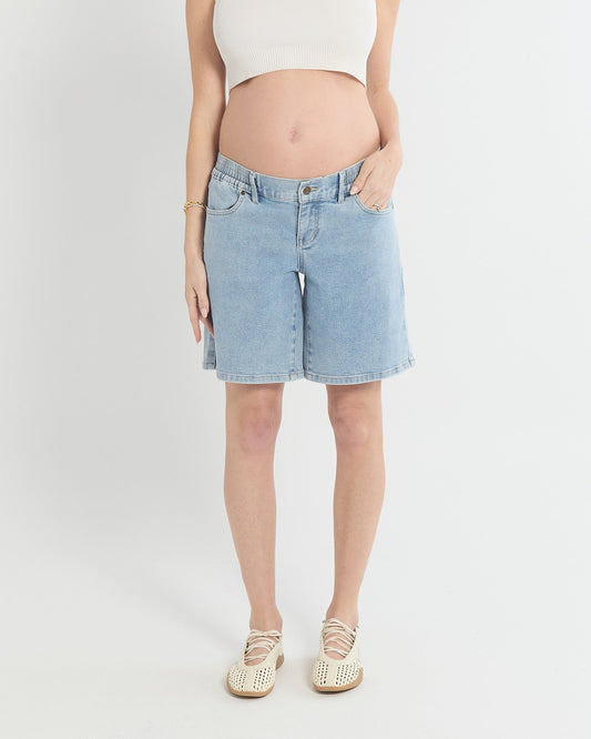 Image of a model wearing Shorts. Product name - Heaven Denim Long Shorts in colour by brand - Soon Maternity