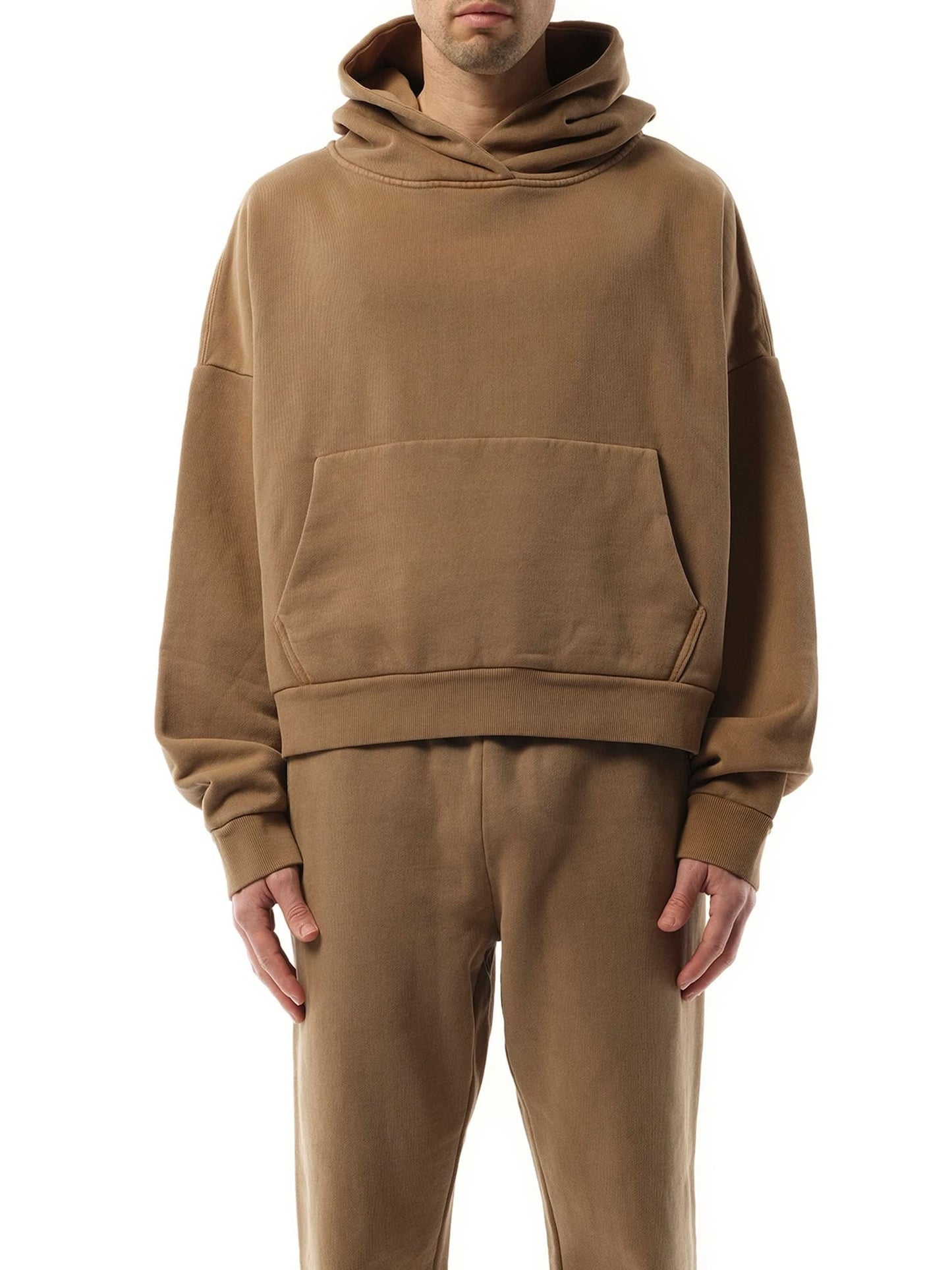 Image of a model wearing Outerwear. Productname: ENTIRE STUDIOS Heavy Hood in Cork colour by brand - ENTIRE STUDIOS