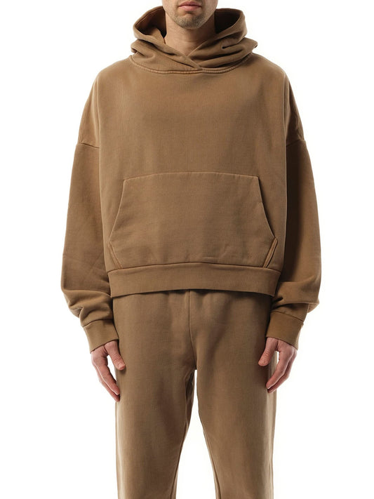 Image of a model wearing Outerwear. Productname: ENTIRE STUDIOS Heavy Hood in Cork colour by brand - ENTIRE STUDIOS
