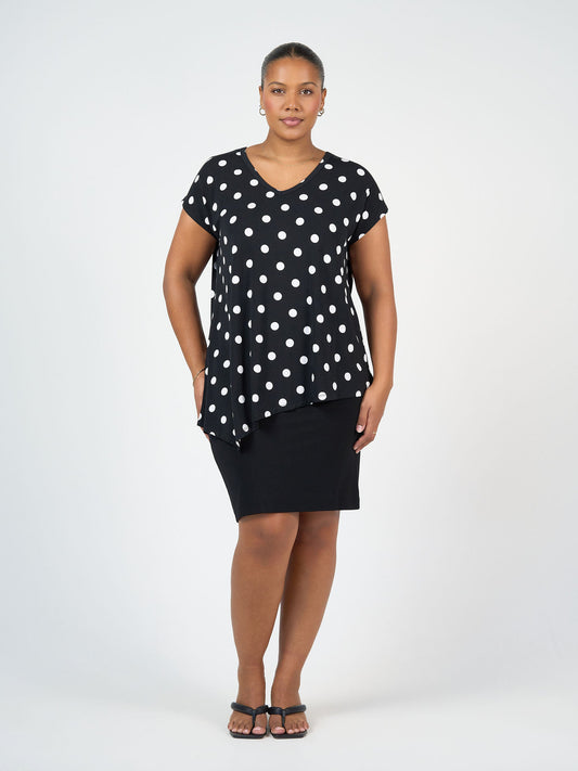 Image of a model wearing Tops. Product name - Holiday Asymmetrical Bamboo V-Neck T-Shirt Polka dot in Polka Dot colour by brand - Lou Lou