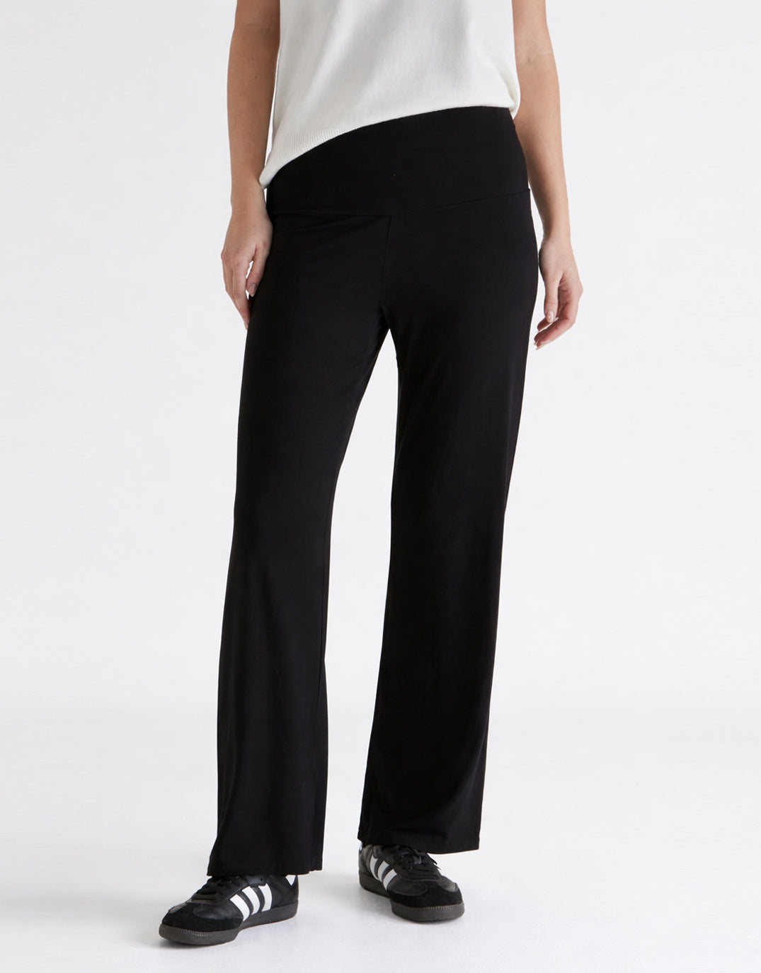 Image of a model wearing Pants. Product name - Houston Relax Pant Black in Black colour by brand - Betty Basics