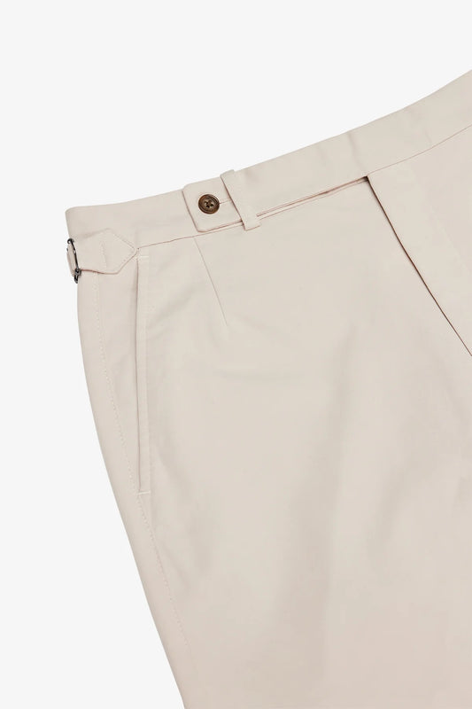 Image of a model wearing Shorts. Product name - Orson Stone Shorts in Stone colour by brand - Anthony Squires