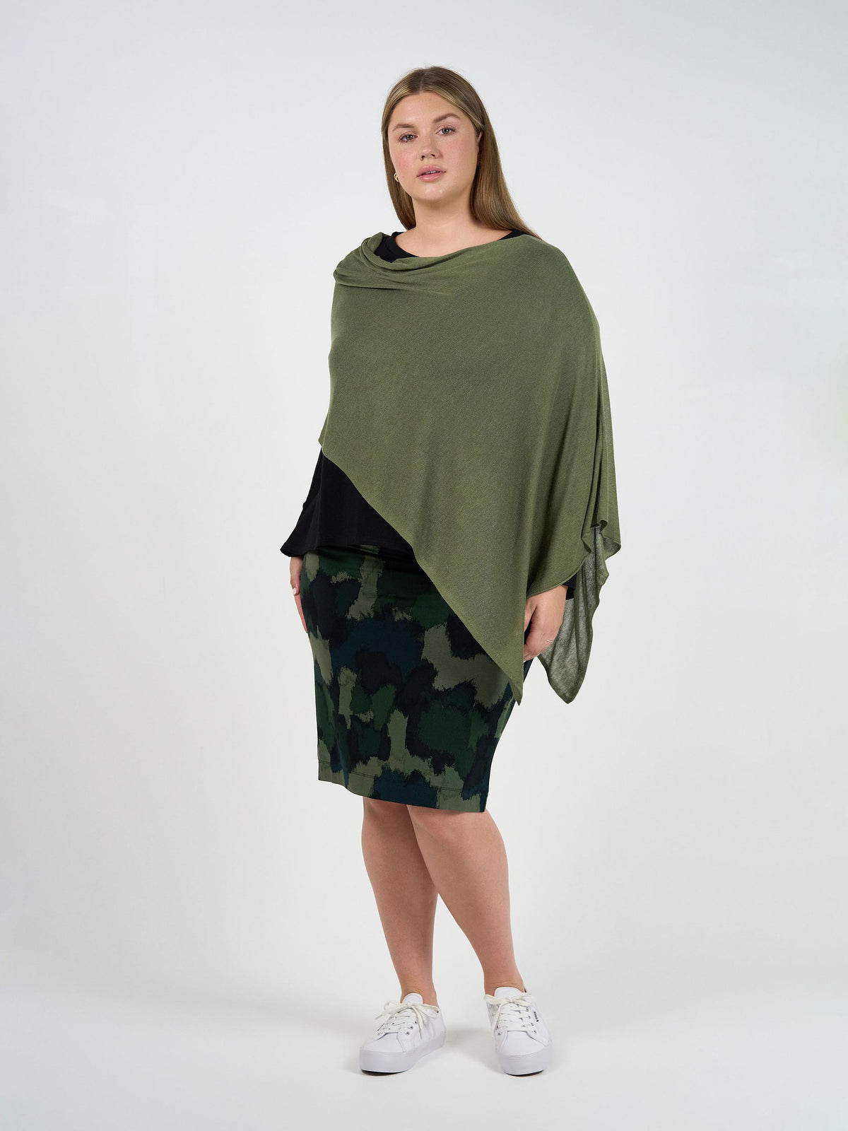Image of a model wearing Tops. Product name - Carrie Cashmere & Bamboo Knit Poncho Olive in Olive colour by brand - Lou Lou
