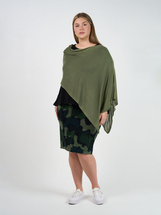 Image of a model wearing Tops. Product name - Carrie Cashmere & Bamboo Knit Poncho Olive in Olive colour by brand - Lou Lou