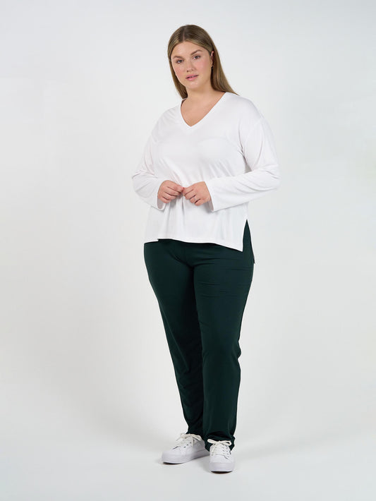 Image of a model wearing Pants. Product name - Warwick Bamboo Fold Over Waist Pant Dark Green in Dark Green colour by brand - Lou Lou