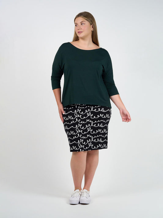 Image of a model wearing Tops. Product name - Camila 3/4 Sleeve Bamboo Top Dark Green in Dark Green colour by brand - Lou Lou