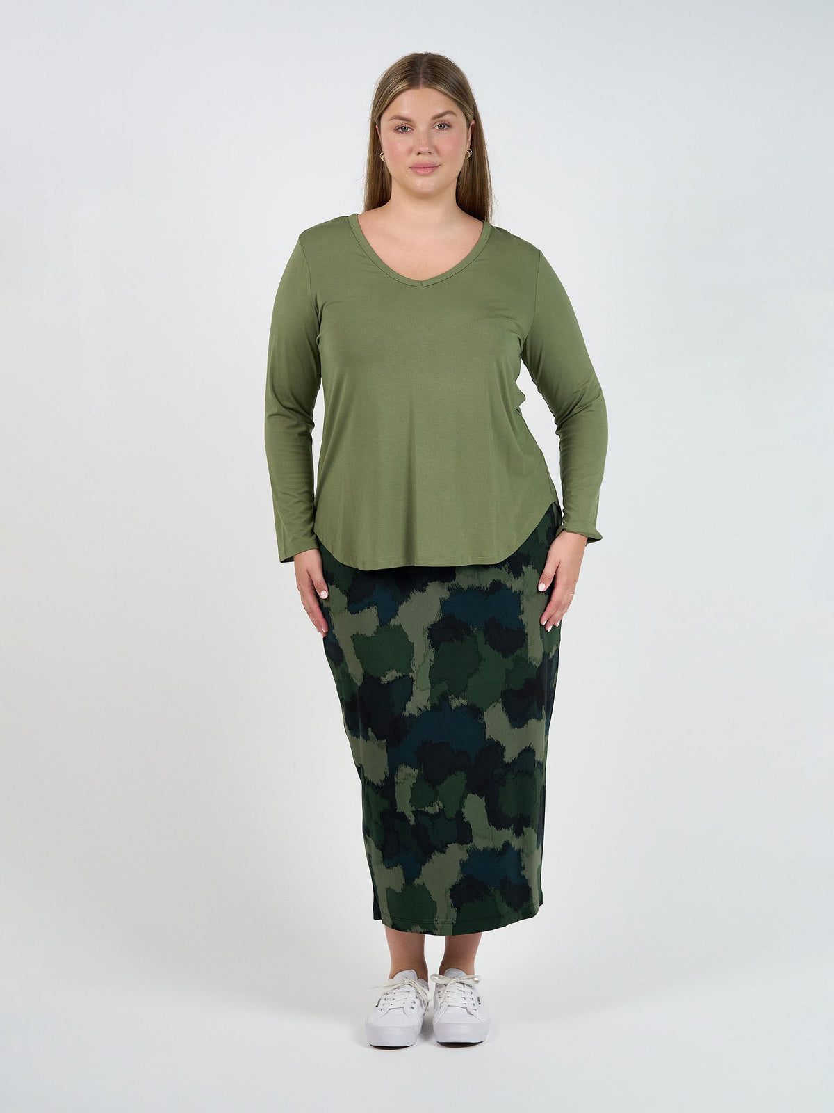 Image of a model wearing Tops. Product name - Sia V Neck Bamboo Longsleeve Top Olive Green in Olive colour by brand - Lou Lou