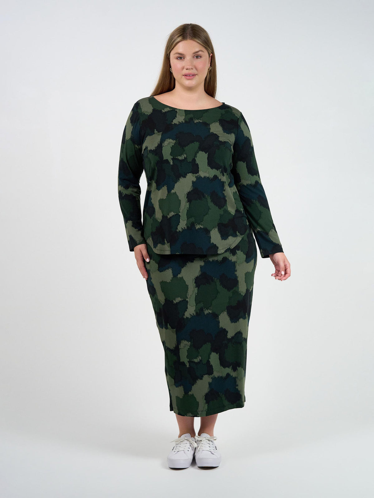 Image of a model wearing Tops. Product name - Adele Long Sleeve Bamboo Top Camouflage Print in Camouflage colour by brand - Lou Lou
