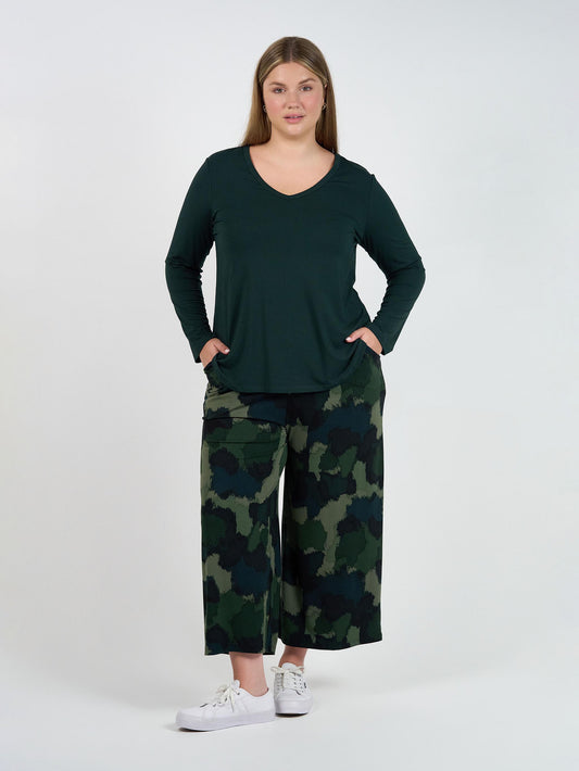 Image of a model wearing Pants. Product name - Ciara 7/8 Length Bamboo Culottes- Camouflage in Camouflage colour by brand - Lou Lou
