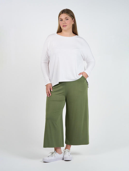 Image of a model wearing Pants. Product name - Ciara 7/8 Length Bamboo Culottes- Olive in Olive colour by brand - Lou Lou