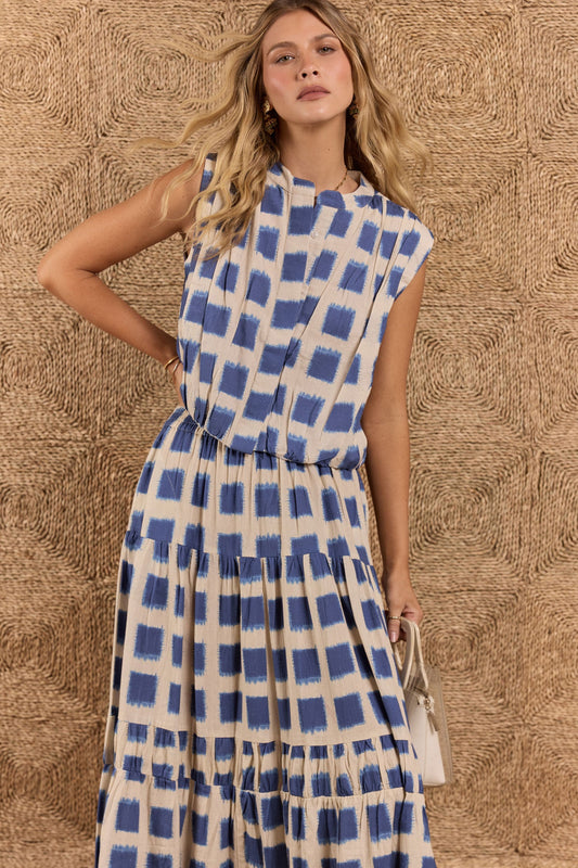 Image of a model wearing Tops. Product name - Itami Bloc S/Less Top Blue in Blue colour by brand - Itami Division