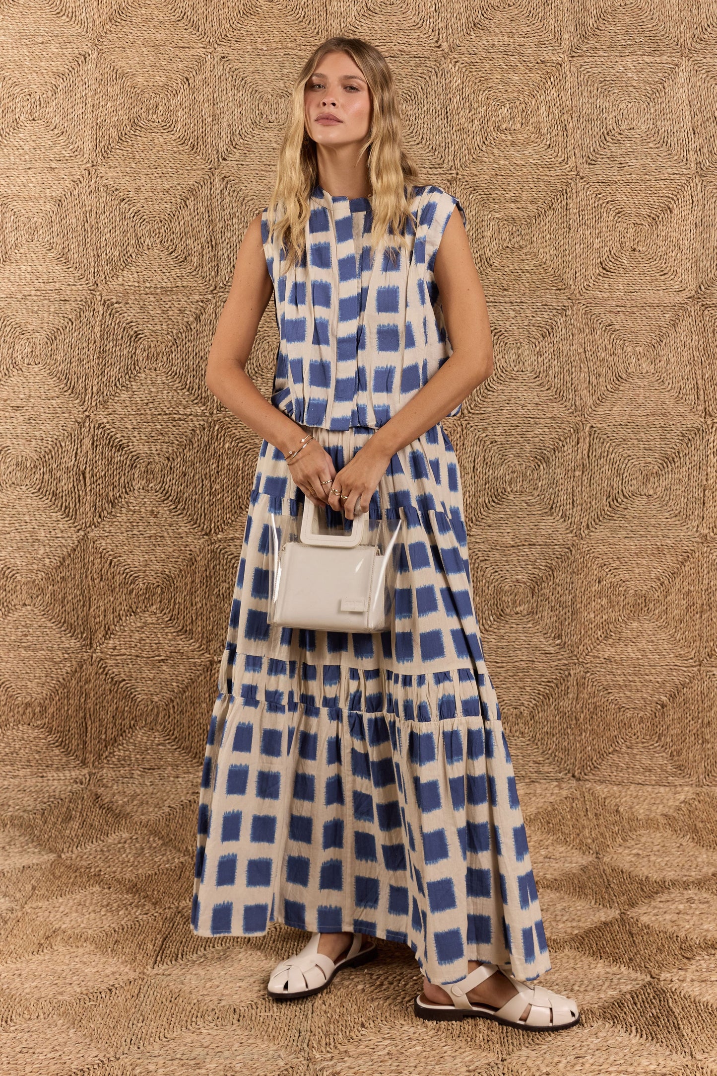 Image of a model wearing Skirts. Product name - Itami Bloc Skirt Blue in Blue colour by brand - Itami Division