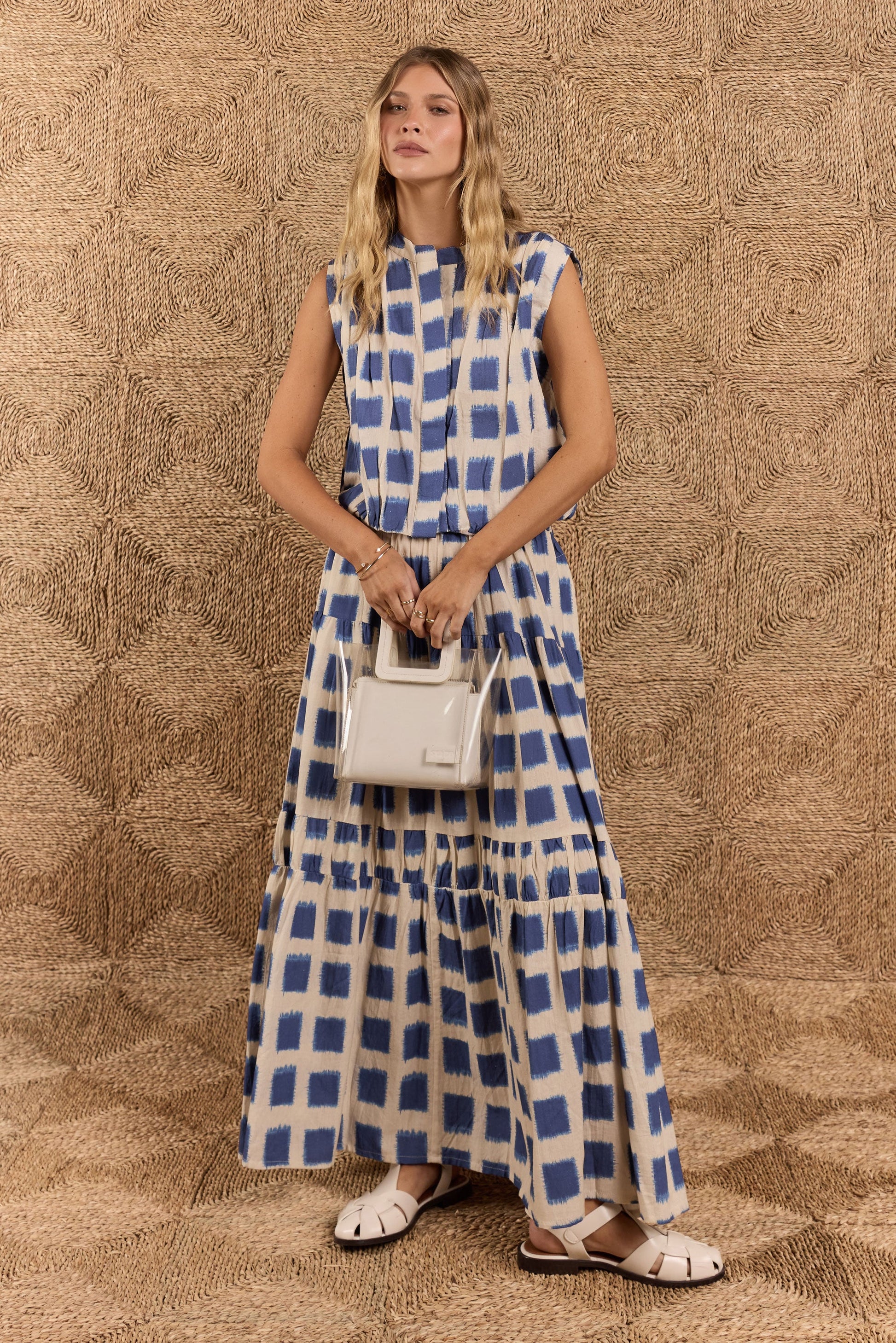 Image of a model wearing Skirts. Product name - Itami Bloc Skirt Blue in Blue colour by brand - Itami Division